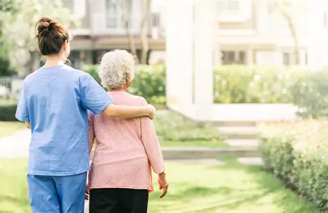 OC HomeCare caregiver assisting elderly woman with in-home senior care in Lake Forest, Irvine, and Orange County, CA