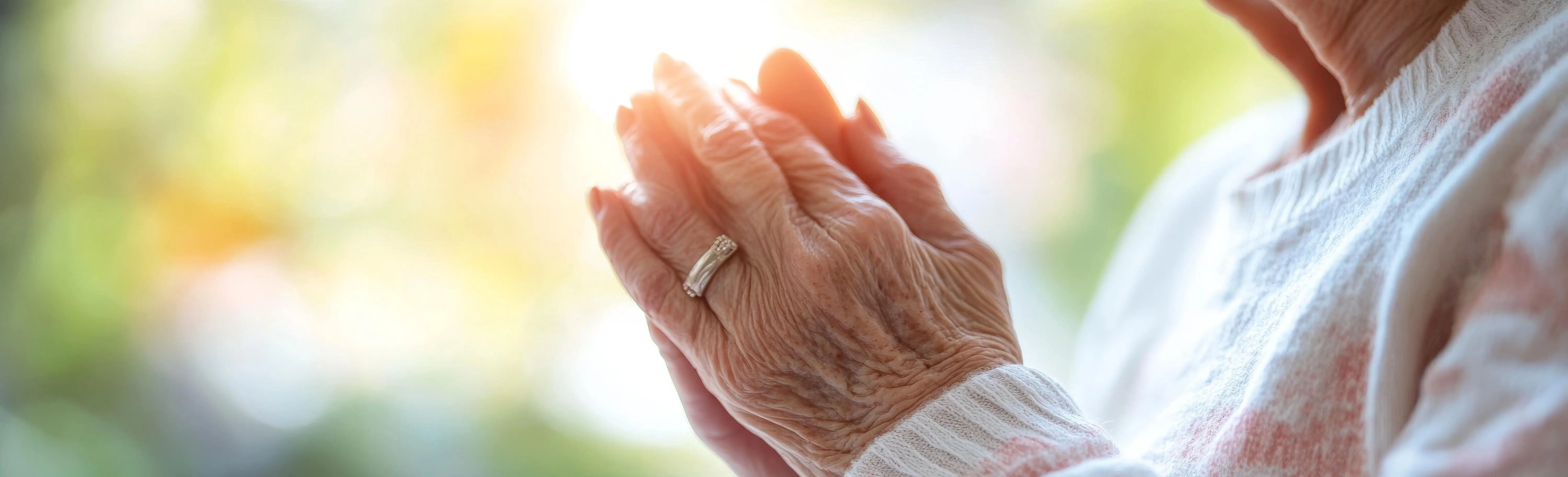 OC HomeCare hospice image showing elderly hands in prayer — symbolizing peace, dignity, and spiritual comfort during end-of-life care in Orange County, CA