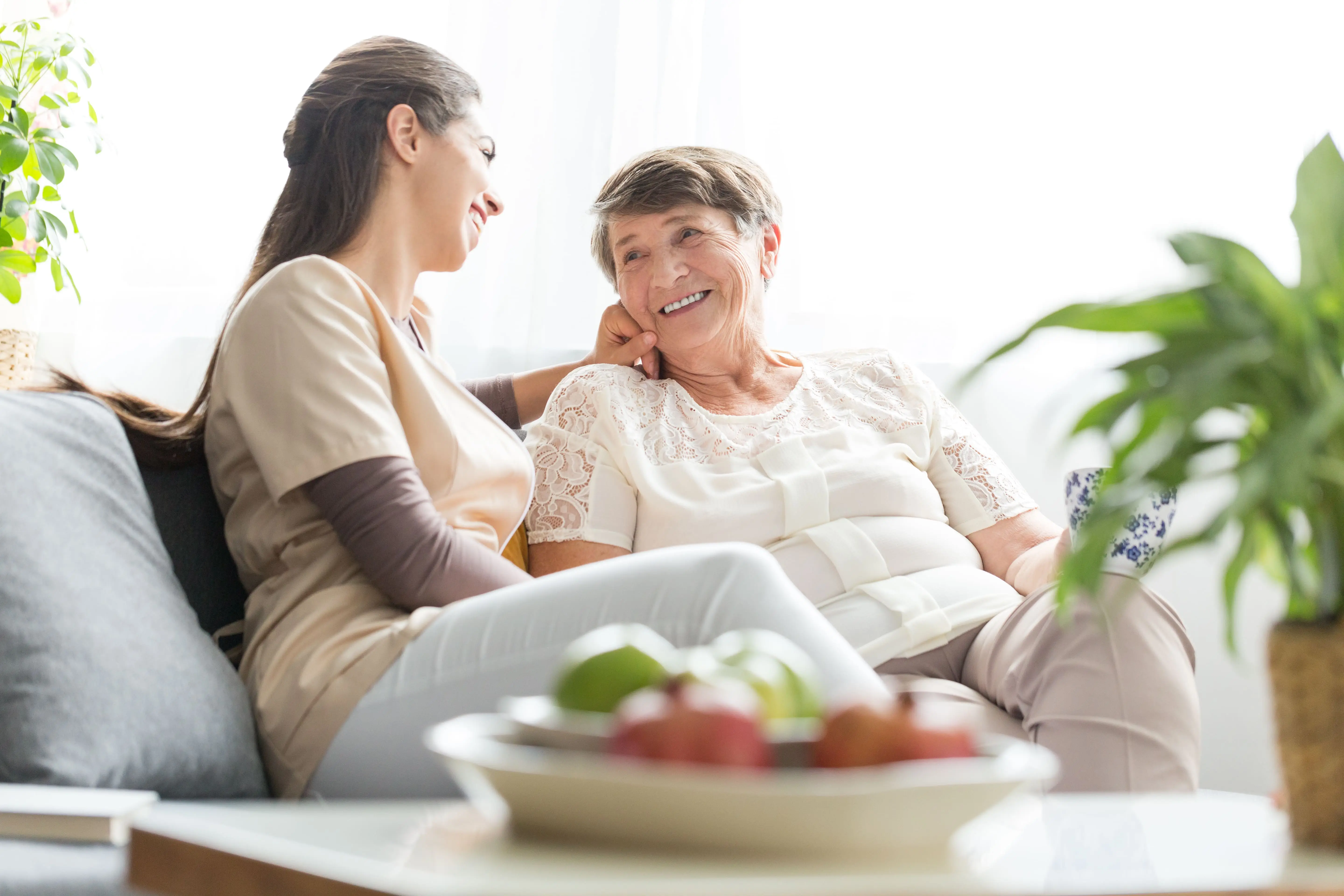 Compassionate OC HomeCare caregiver providing personalized in-home senior care in a warm Orange County environment