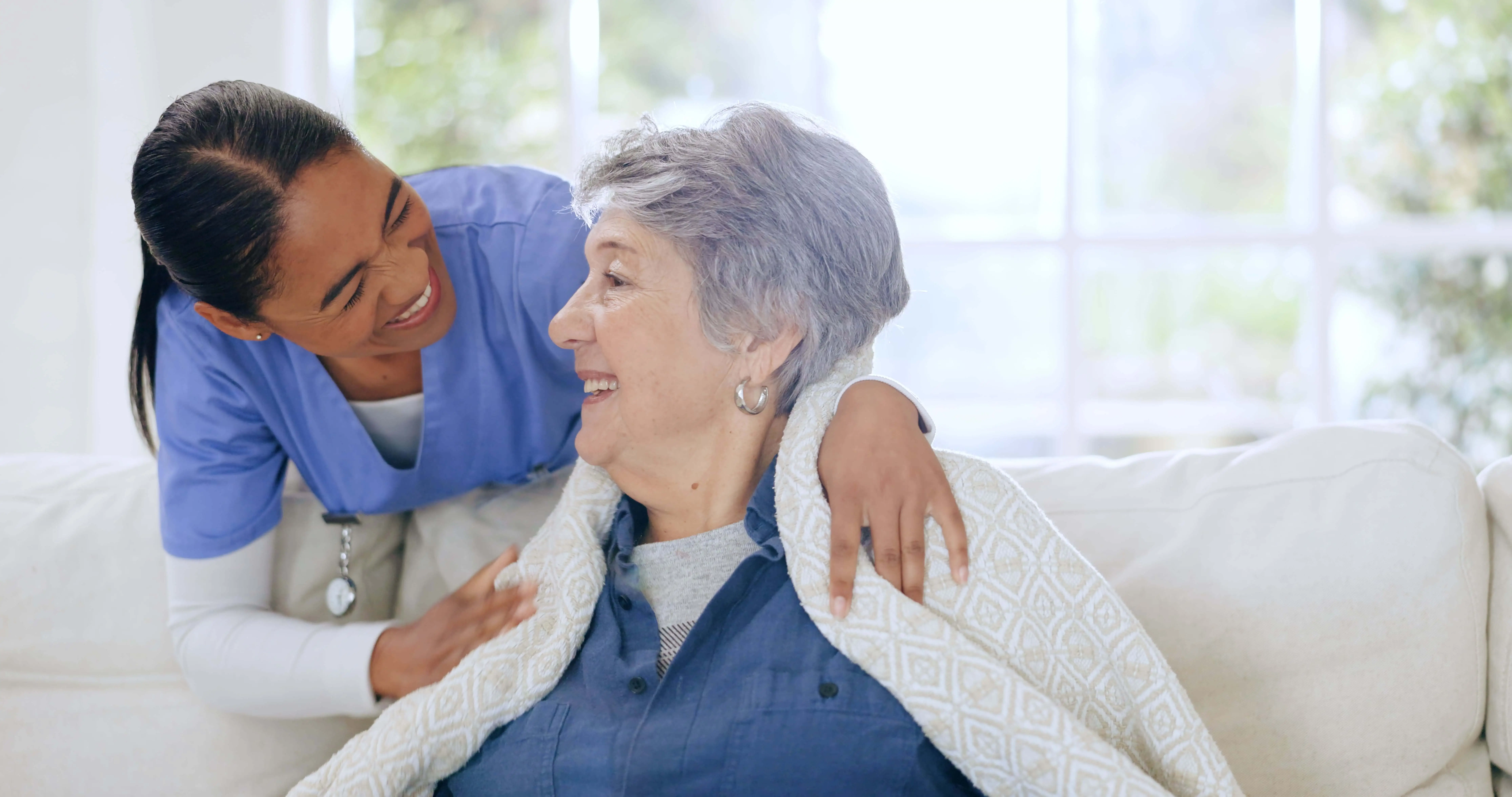 OC HomeCare caregiver offering warm, compassionate in-home support to elderly woman in Lake Forest, Orange County