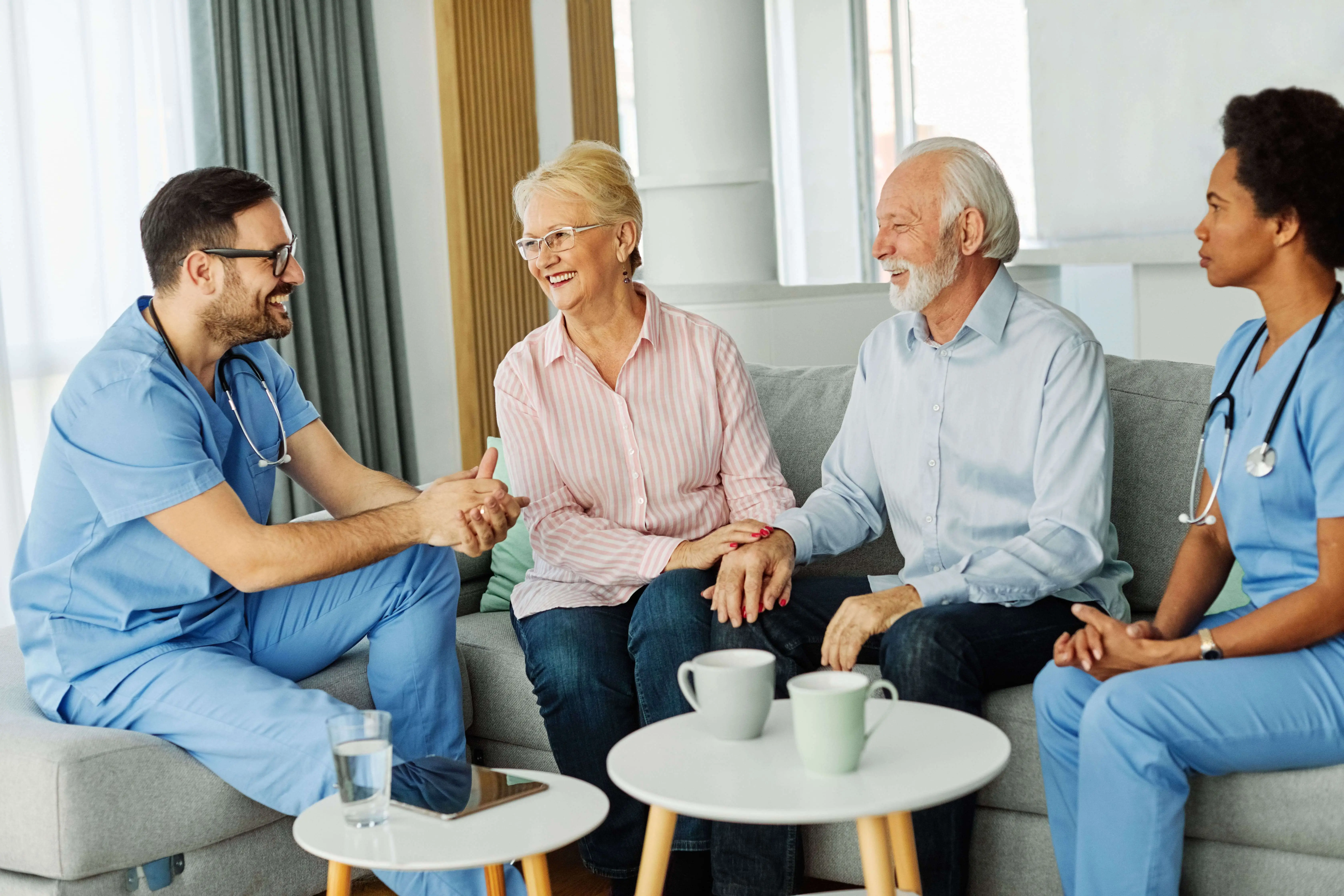 OC HomeCare caregivers conducting a personalized in-home care consultation with a senior couple in La Palma, CA – trusted support for local families