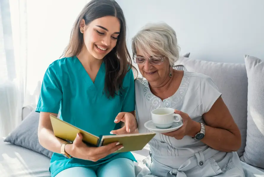 OC Homecare caregiver providing friendly respite care for a senior woman in Orange County, offering relief for family caregivers