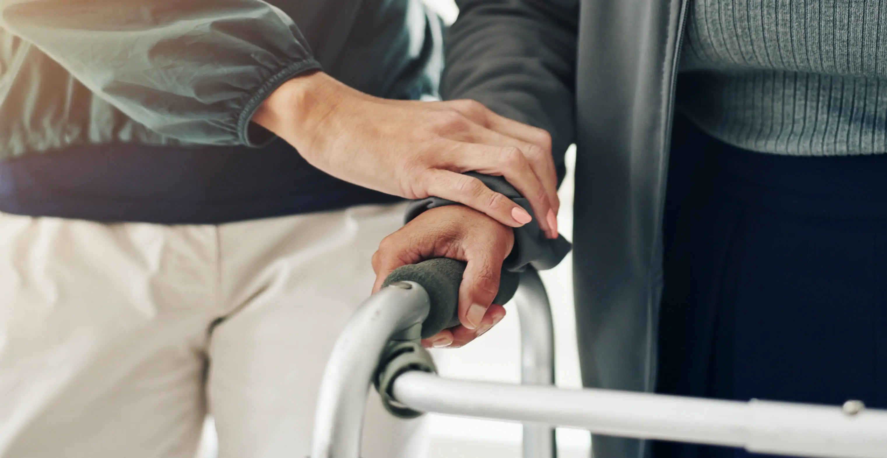 OC HomeCare caregiver providing compassionate in-home companion care and walker assistance to senior in Dana Point, CA
